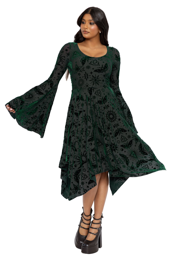 Whimsigoth handkerchief dress with celestial sigils, moths and mystical witch symbols woven through pine green burned velvet. This gothic midi dress combines dark fairycore and cottage witch aesthetics with a romantic flowing silhouette and dramatic movement.