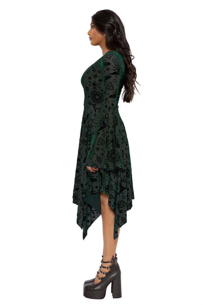 Gothic burned velvet spectre dress with occult inspired artwork, sheer mesh layers and dramatic bell sleeves. Featuring a fitted bodice and asymmetric hemline, this alternative goth dress blends fantasy witch and dark academia fashion with elegant witchcore styling.