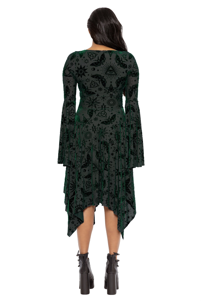 Fantasy witch inspired pine green velvet dress with celestial sigils, mystical symbols and flowing handkerchief hems. This dark fairycore midi dress combines whimsigoth and gothic romantic fashion with dramatic sleeves and floaty movement.