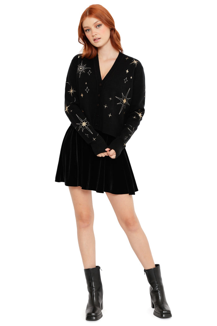 Black knit cardigan with delicate gold star and constellation embroidery, featuring a flattering V-neck shape