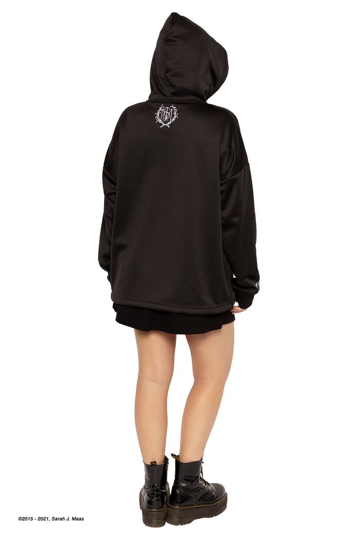 ACOTAR series Suriel Spill the Tea hoodie, inspired by A Court of Thorns and Roses books by Sarah J Maas, featuring oversized silhouette, soft fleece lining, hood and graphic print design, casual fantasy outfit