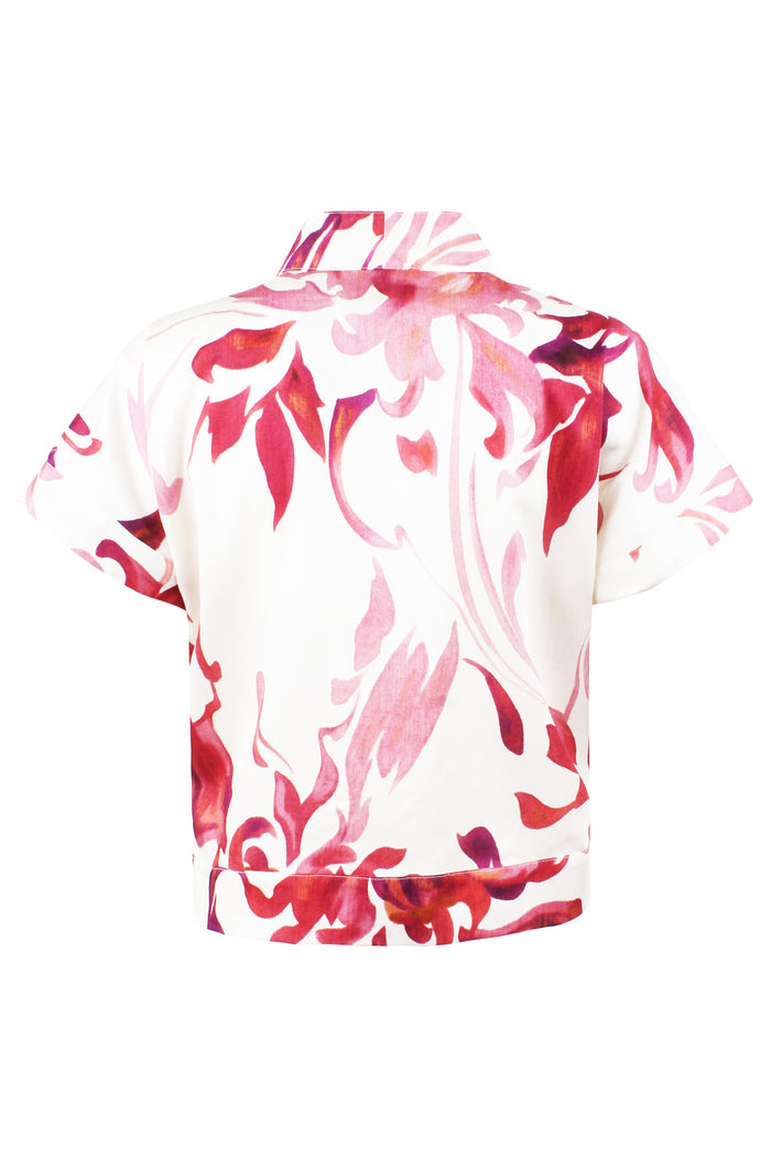 White shirt with red floral pattern on a white background
