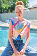 a model front view of the Finley Sydney blouse with a sleeveless design, popover style, relaxed contour, cropped length, and watercolor print.