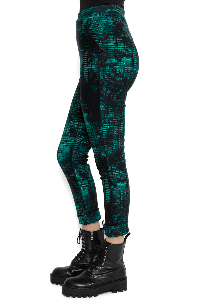 Model wearing Fallout x BlackMilk Termlink Hacking Pants with green code pattern reminiscent of Fallout terminal interface.
