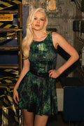 Model wearing Fallout x BlackMilk Termlink Hacking Underbust Skater Dress featuring green terminal code print and Pip-Boy icon.