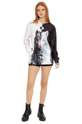 Front view of The Beast Within Hoodie Sweater from the Lora Zombie collection, featuring a split black and white design with illustrated wolf artwork.
