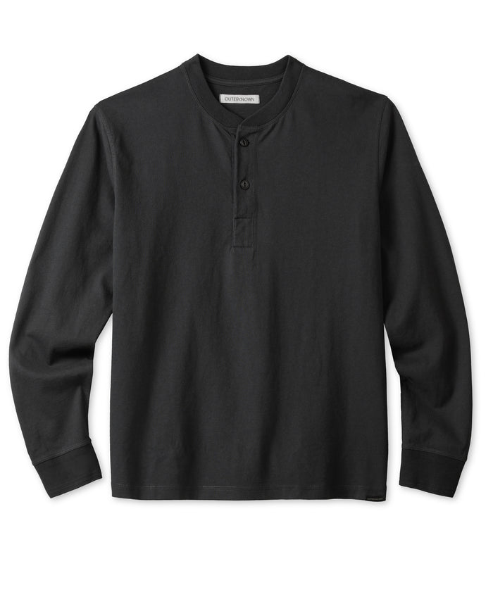 A black long-sleeved henley shirt with a ribbed neckline and cuffs, featuring a two-button placket and corozo nut buttons.