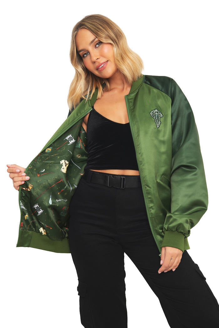 Detail shot of the ribbed collar and sleeve patch on the BlackMilk Fellowship Souvenir Jacket, a green gothic-meets-varsity bomber from the Lord of the Rings collection.