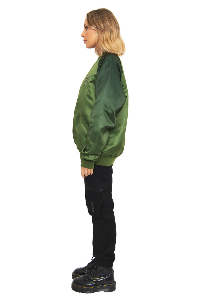 Side profile of the Fellowship Souvenir Jacket by BlackMilk, showing the relaxed bomber silhouette and ribbed cuffs in a deep green Lord of the Rings-inspired colorway.
