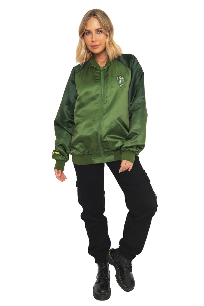 Front view of a model wearing the BlackMilk Fellowship Souvenir Jacket, a green bomber-style jacket from the Lord of the Rings collection inspired by the Fellowship of the Ring.