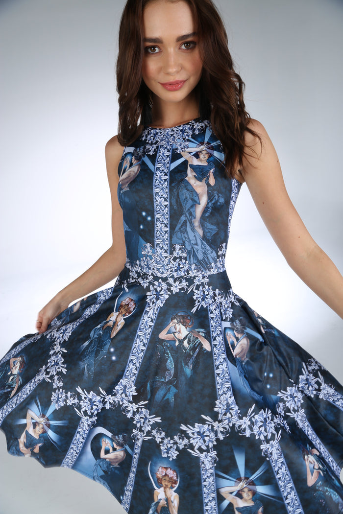 The Moon And The Stars Longline Princess Dress by BlackMilk, inspired by Alphonse Mucha artwork with celestial female figures, blue skater dress with high neckline and pockets