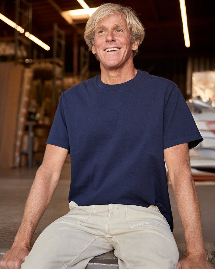 Man wearing navy blue short sleeve t-shirt