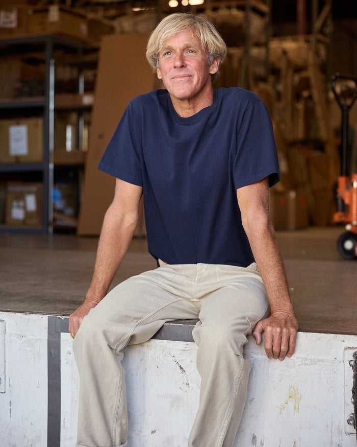 Man wearing navy blue short sleeve t-shirt