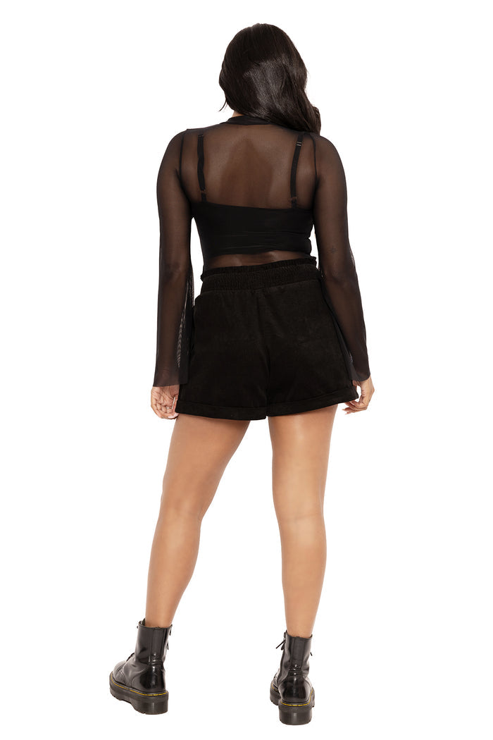 Gothic embroidered corduroy paper bag shorts featuring Ami Raithe’s moth artwork and dark forest-inspired insect details. A witchcore fashion staple with a relaxed fit, elasticated waistband and cuffed A-line silhouette, styled for dark academia, pagan aesthetic and whimsical goth outfits.