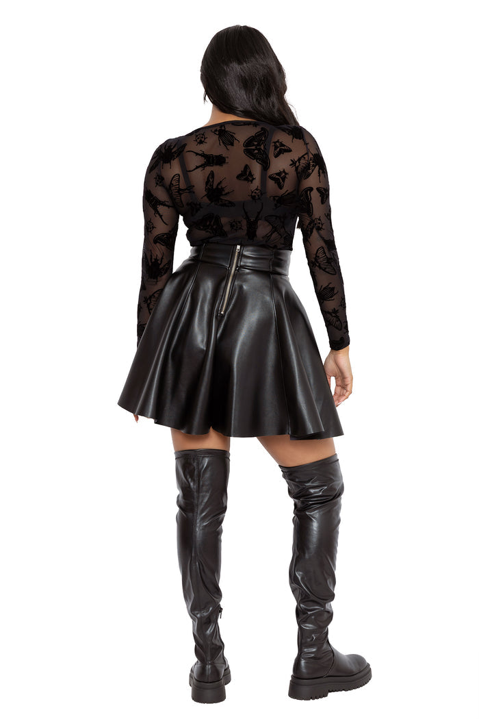 Gothic sheer mesh top with black velvet-look moth and bug artwork designed by Ami Raithe. Featuring a flattering fitted silhouette, boat neckline and long sleeves, this alternative witchcore top is perfect for dark academia and pagan inspired outfits.