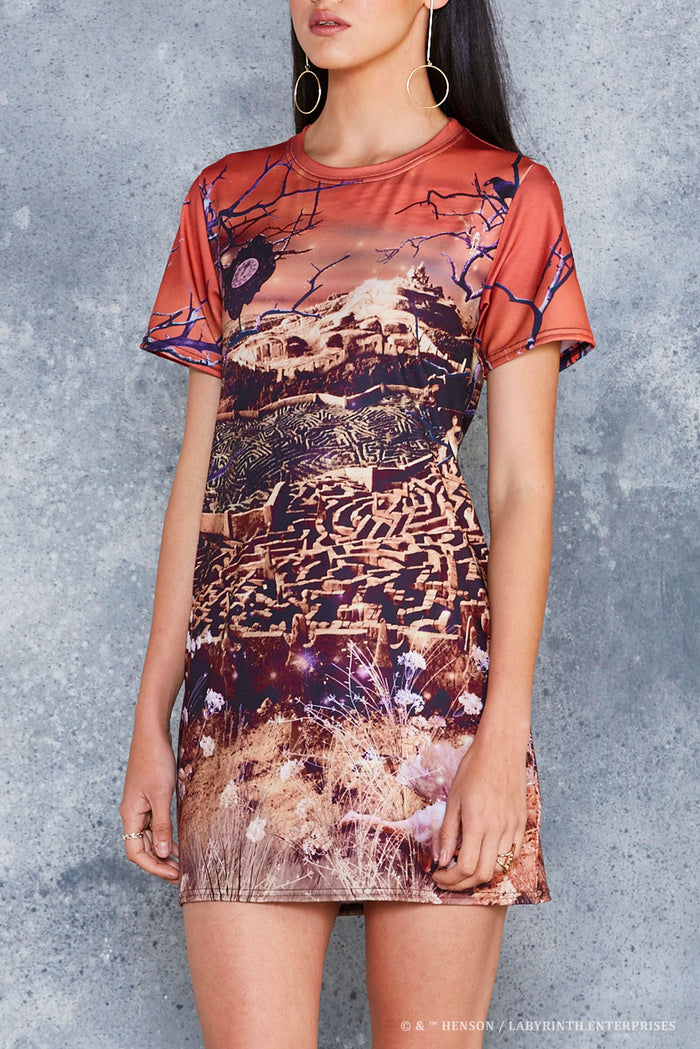 BlackMilk Labyrinth Turn Back Tee Dress - officially licensed Jim Henson's Labyrinth (1986) merch featuring an all-over print of the Goblin City maze and castle under a fiery sunset sky - close-up front view of the print detail.