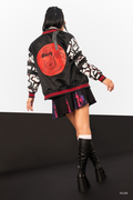 Back view of Junji Ito x BlackMilk Uzumaki satin varsity jacket featuring large red spiral vortex artwork with Kirie and Shuichi, black anime streetwear bomber jacket with manga print sleeves.