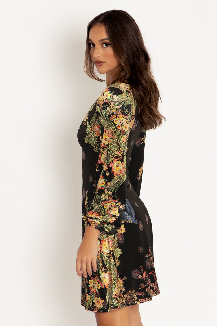 Women's velvet maxi dress with flowing bishop sleeves, combining timeless elegance and comfortable stretch fabric for occasion wear and statement styling.