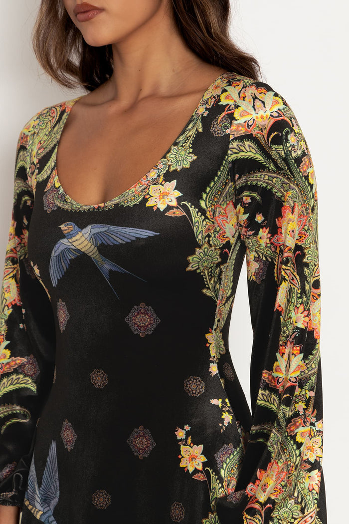 Scoop neck velvet dress with flowing bishop sleeves and longline fit, designed for comfort, movement and effortless occasion dressing.