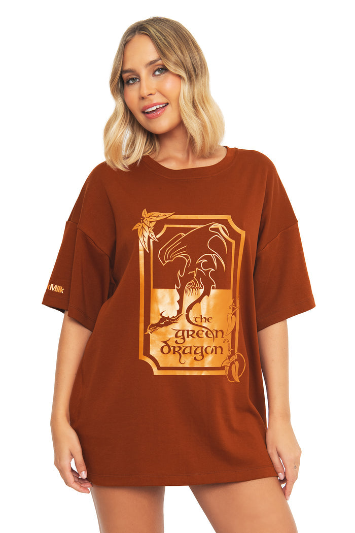 Close-up front view of the BlackMilk Lord of the Rings What About Elevenses? Big Tee, showing The Green Dragon pub graphic in rust brown oversized cotton.