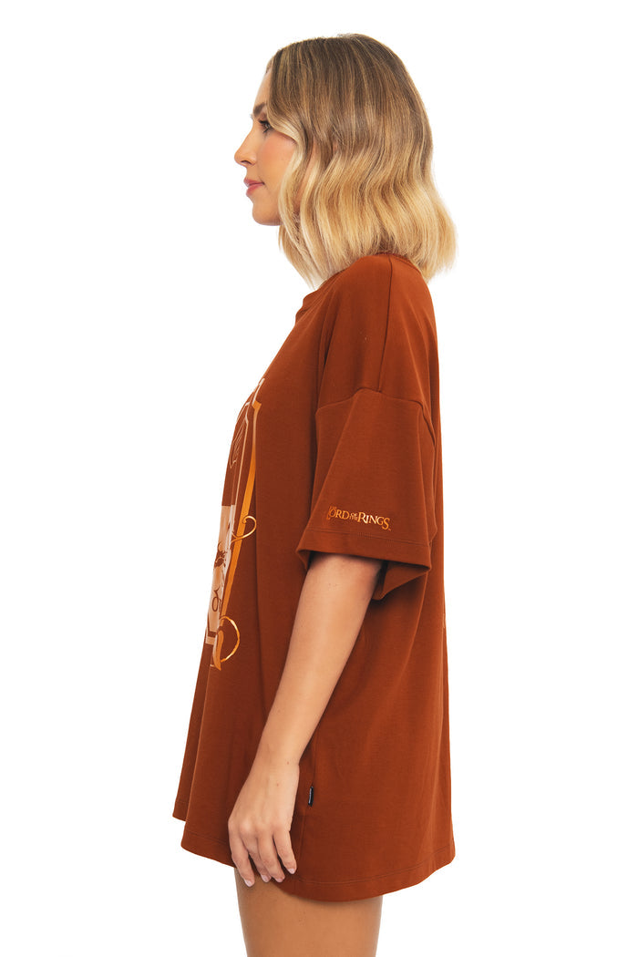 Full-length styled look of the BlackMilk What About Elevenses? Big Tee paired with black boots, a hobbit-inspired oversized streetwear tee from the Lord of the Rings collection.